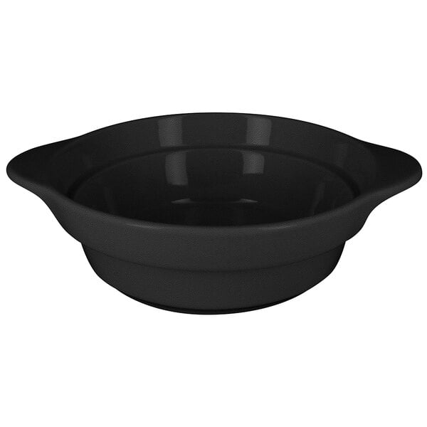A black RAK Porcelain round porcelain cocotte with a handle.