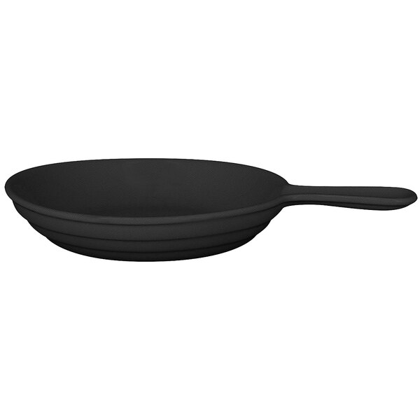 A black RAK Porcelain frying pan with a white interior and handle.