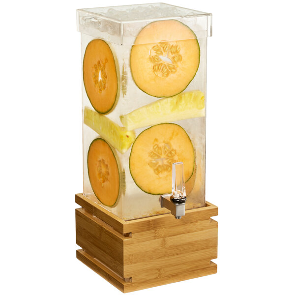 A Rosseto clear acrylic rectangular beverage dispenser with fruit slices in the water.