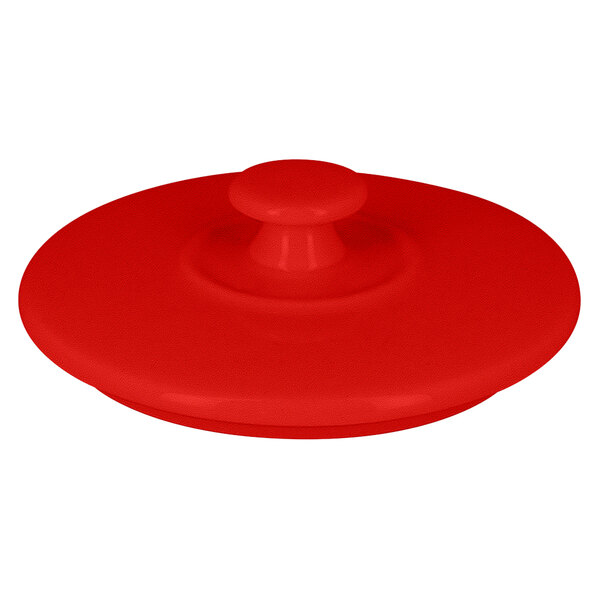A round red porcelain lid.