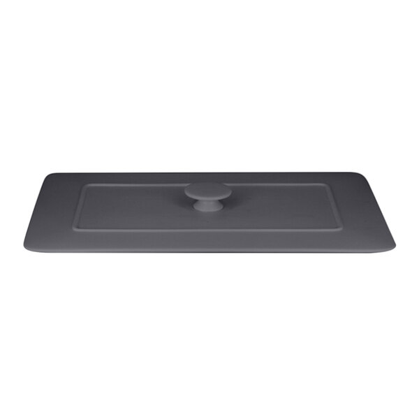A stone gray rectangular porcelain lid with a round handle.