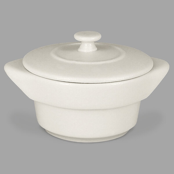 A RAK Porcelain sand white round porcelain cocotte with lid.