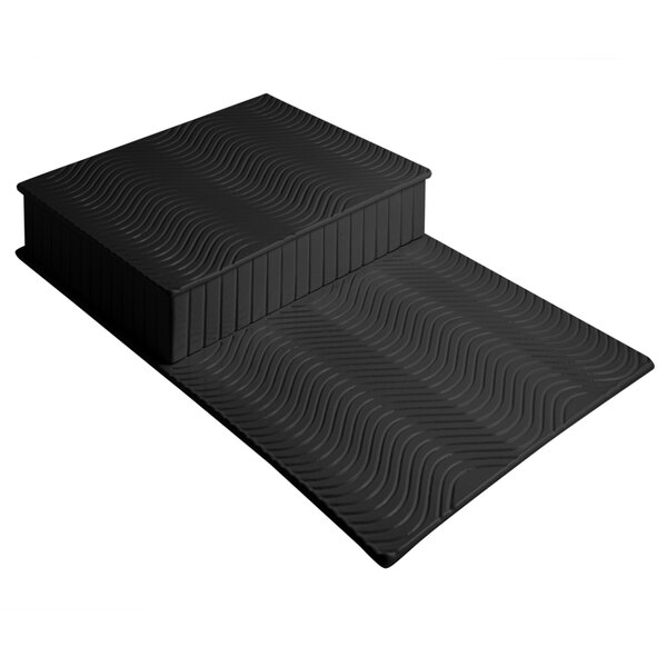 A black rectangular display riser with a wavy pattern.