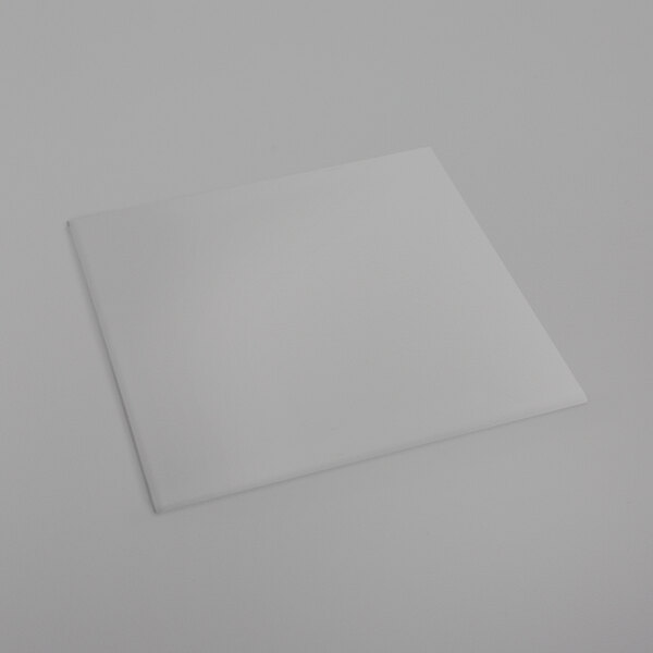 A clear square Bon Chef plastic riser shelf on a white surface.