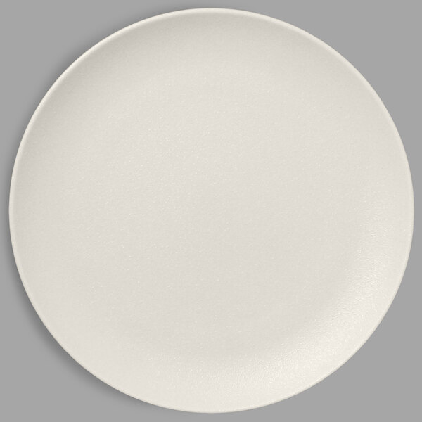A RAK Porcelain Sand White coupe plate on a white surface.