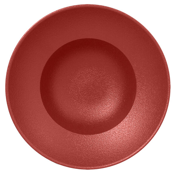 A dark red porcelain plate with a white background.
