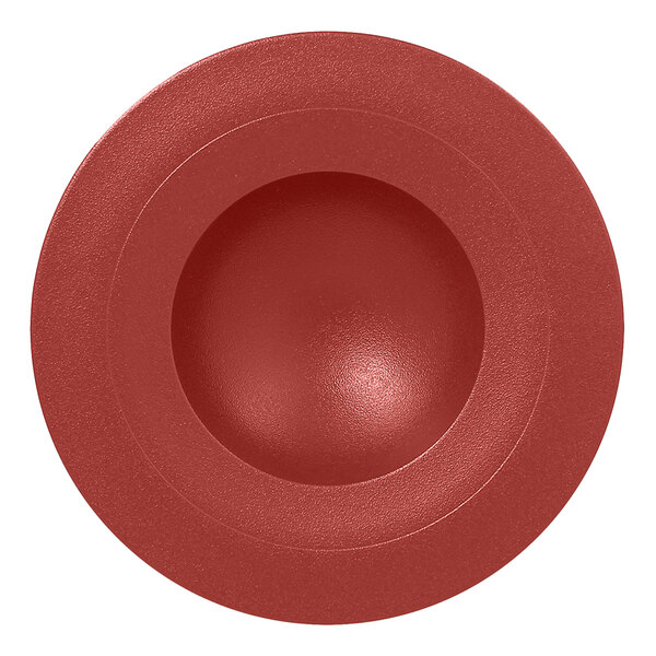 A red round RAK Porcelain deep plate with a white background.