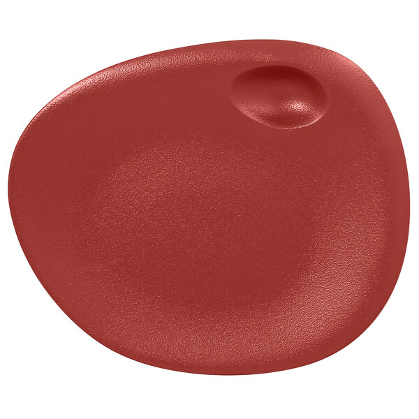 A dark red porcelain plate with a round center.