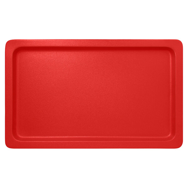 A red rectangular porcelain tray with a white border.