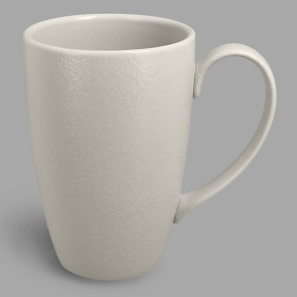 A close-up of the white handle on a RAK Porcelain Neo Fusion mug.