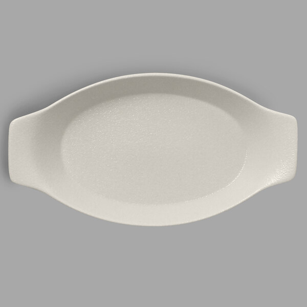 A white oval porcelain dish with handles.