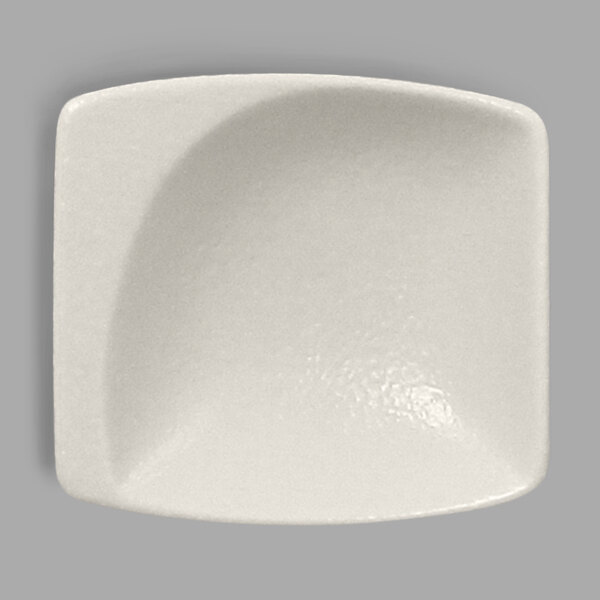 A white square bowl with a curved edge.