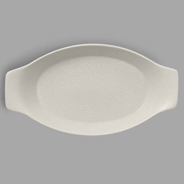 A white oval RAK Porcelain dish with handles.