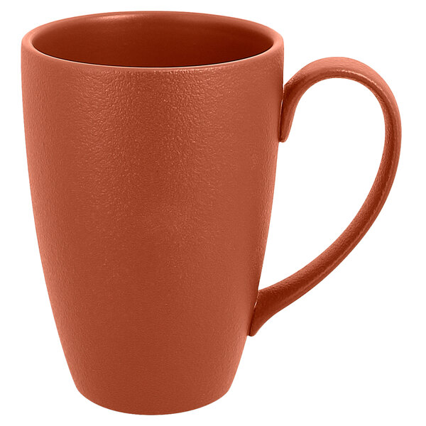 A brown RAK Porcelain mug with a brown handle.