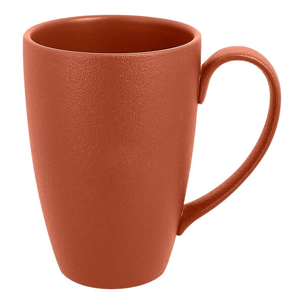 A brown RAK Porcelain mug with a brown handle.