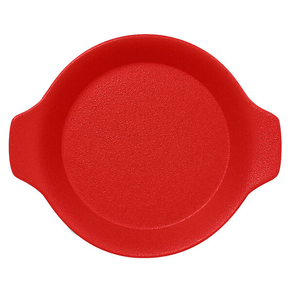 A red round porcelain dish with handles.