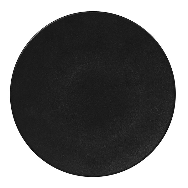 A round black porcelain plate with a blank background.