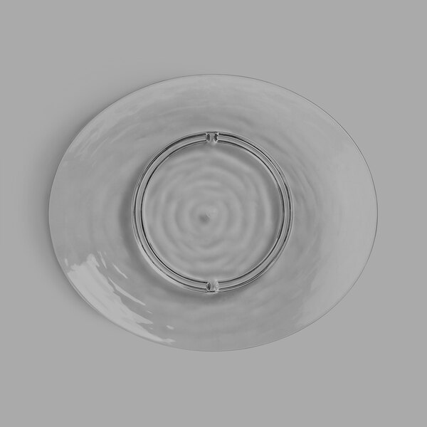 A Libbey Tritan plastic snack plate with a circular design on the rim.