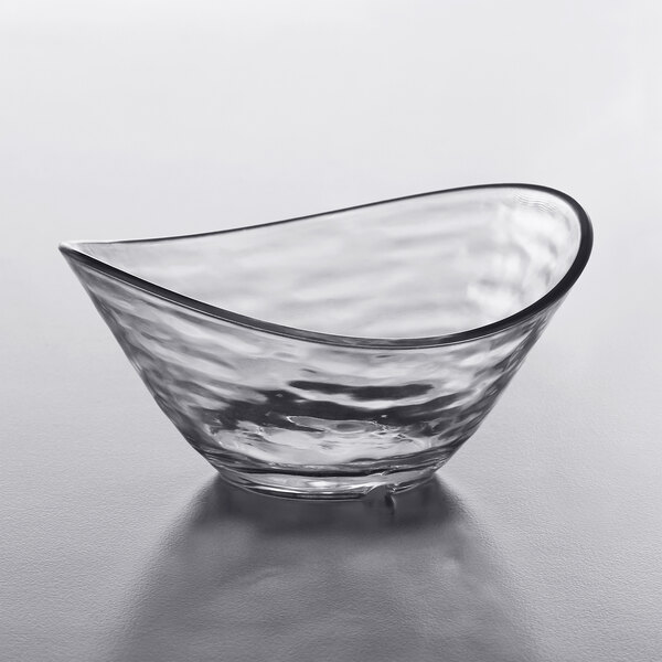 A clear Libbey Tritan plastic dip dish on a white surface.