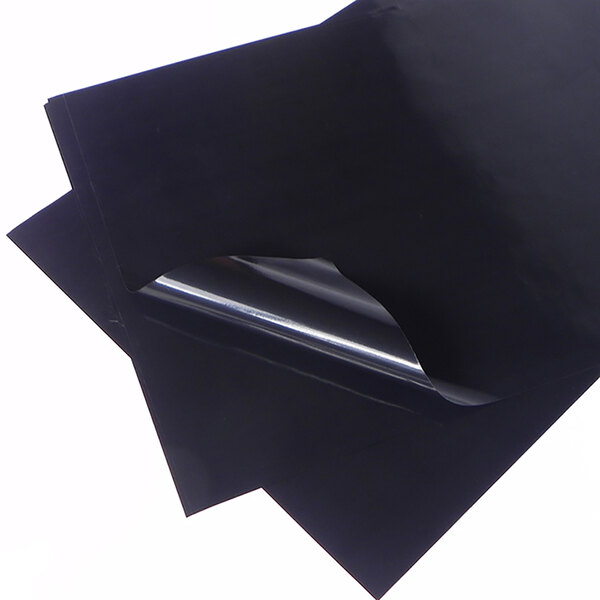 A black PTFE non-stick release sheet on a white background.
