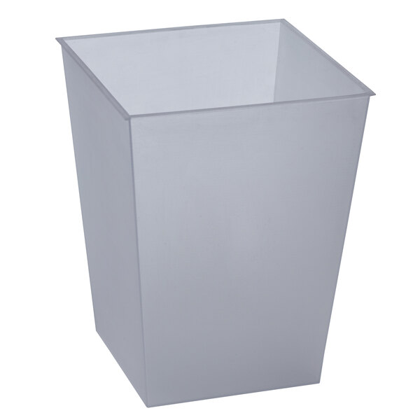 A clear plastic liner for a white rectangular wastebasket.