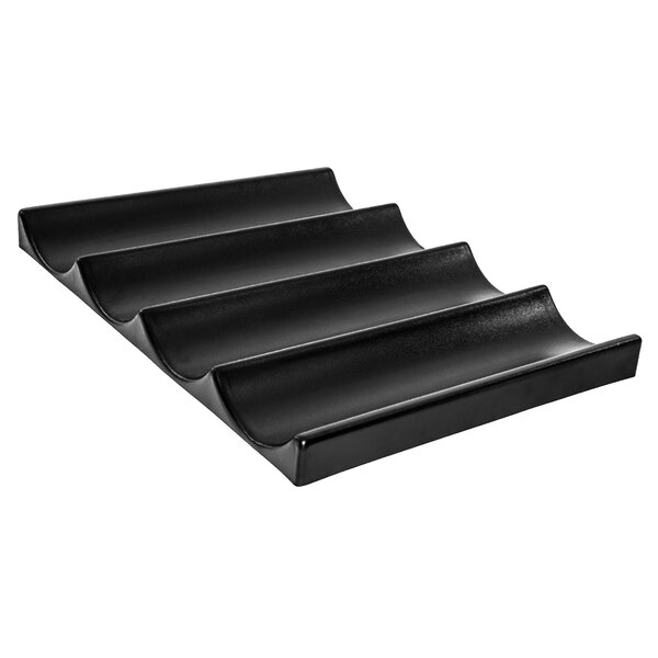 A black plastic tray with curved lines and four steps.