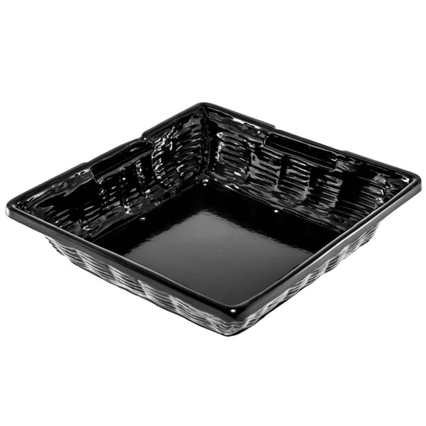 A Marco Company black wicker-look plastic basket on a counter.