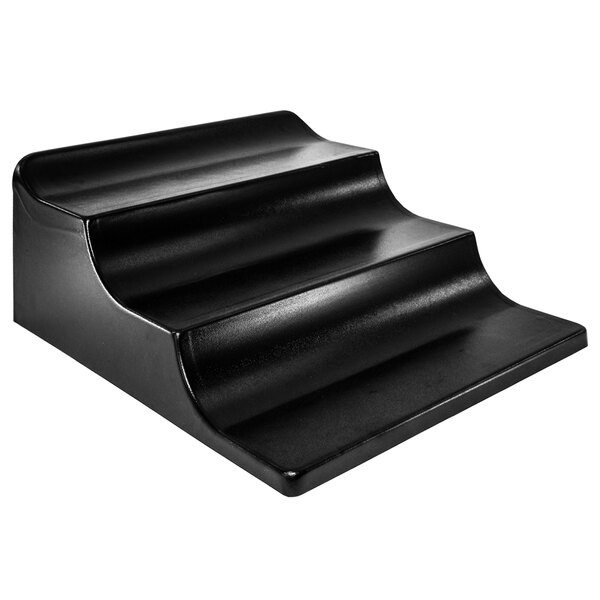A black plastic Marco Company 3-step banana riser with a curved design.