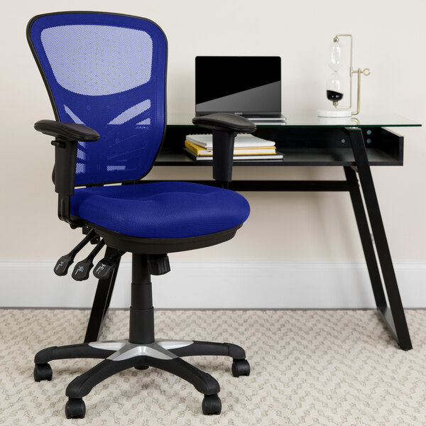 A blue Flash Furniture office chair with triple paddle controls next to a black desk.