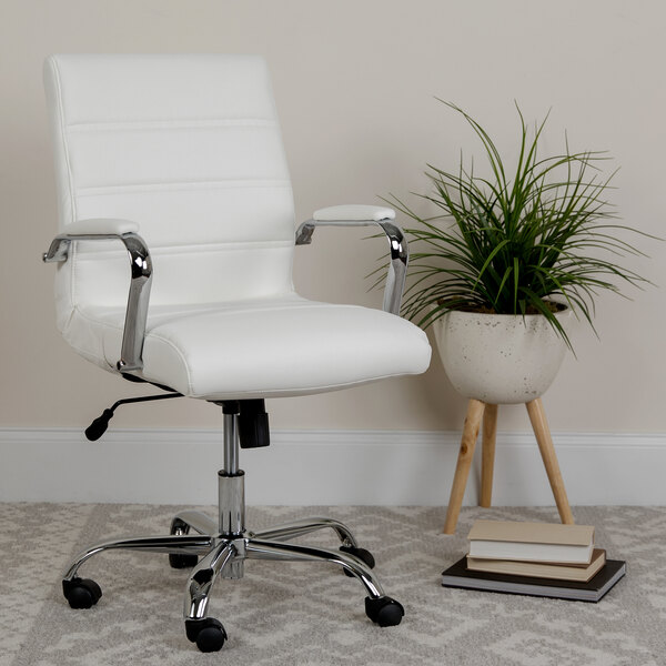 A white Flash Furniture office chair with chrome arms next to a potted plant.