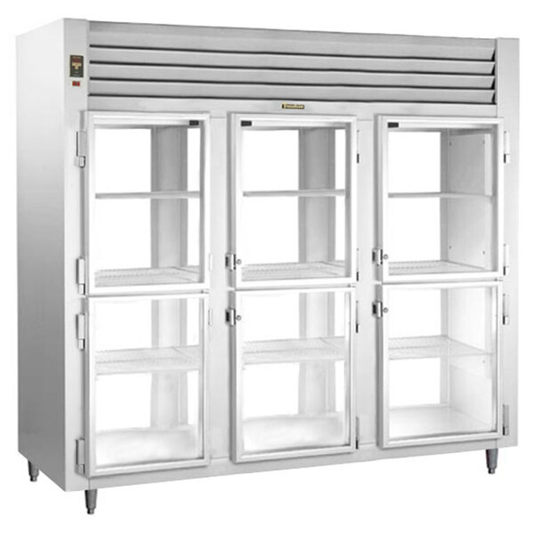 A Traulsen white pass-through refrigerator with glass doors.