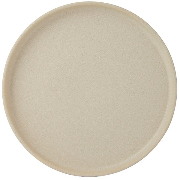 A Tuxton TuxTrendz Zion Matte Beige china plate with straight sides and a round rim.