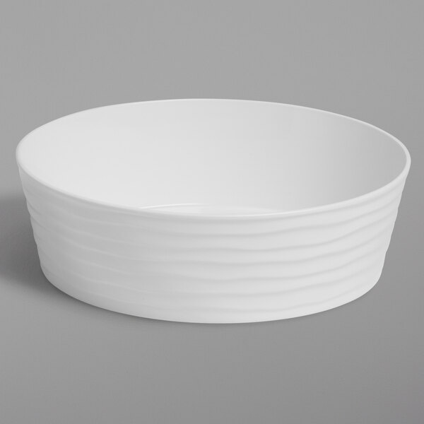 An American Metalcraft Del Mar white plastic serving bowl with wavy lines.