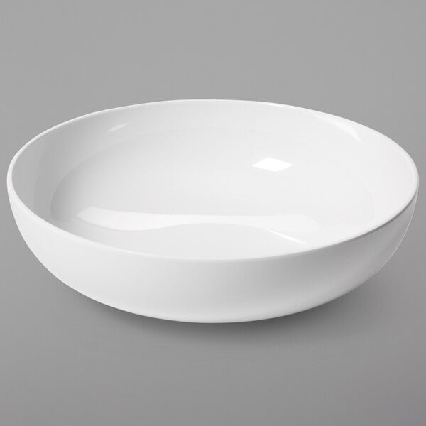 A GET ivory melamine serving bowl on a white surface.
