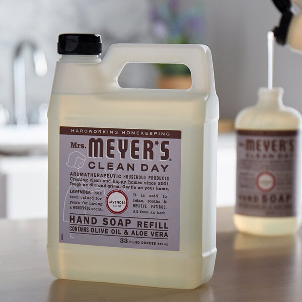 A white Mrs. Meyer's Clean Day hand soap refill jug on a counter.