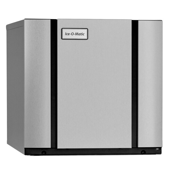 An Ice-O-Matic air cooled ice machine with a silver and black rectangular object and a black door.