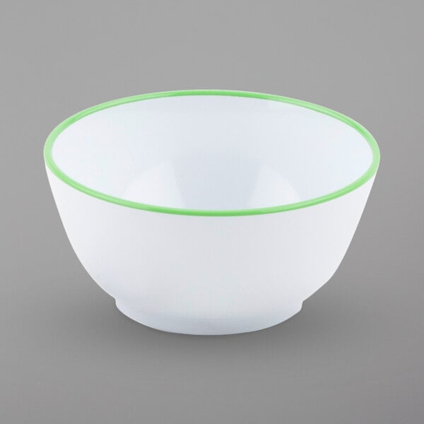 A white bowl with a green rim.