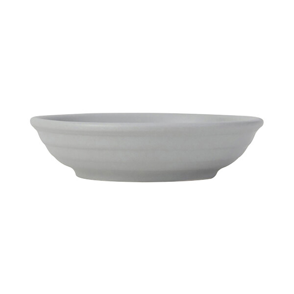 A Tuxton TuxTrendz white china fruit bowl with a grey embossed surface.