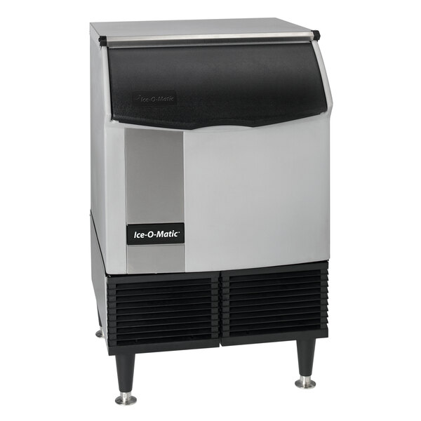 An Ice-O-Matic undercounter ice machine with a black and silver surface.