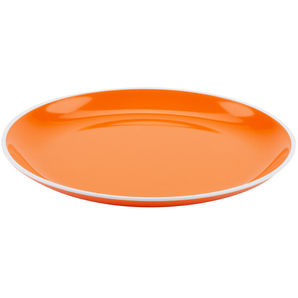 A tangerine orange melamine dinner plate with a white rim.