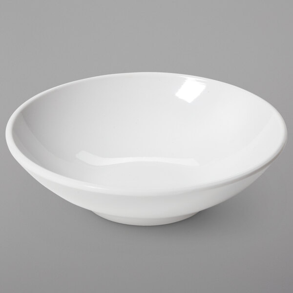 A GET ivory melamine side dish bowl on a white surface.