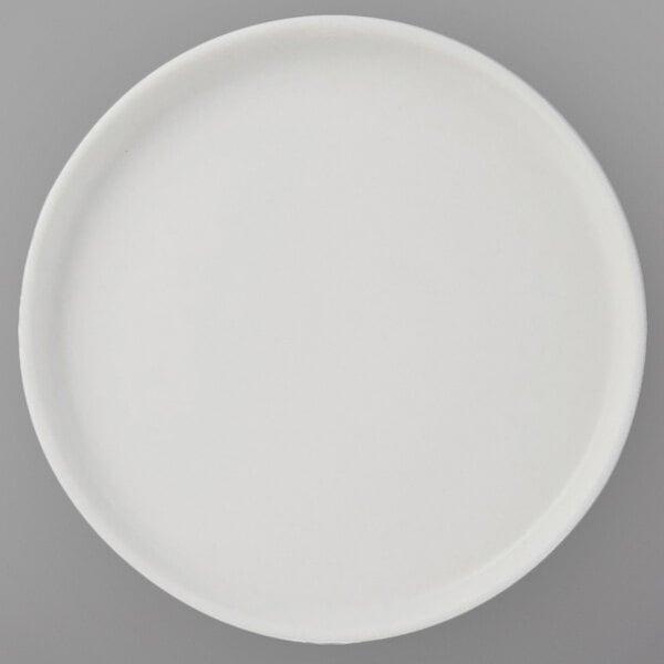A Tuxton TuxTrendz white china bread and butter plate with straight sides on a gray surface.