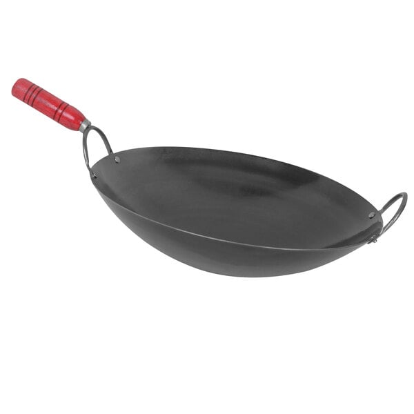 A black Thunder Group wok with a wood handle.