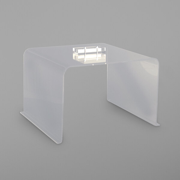 A white rectangular table with a clear plastic Bon Chef breath guard and LED light.