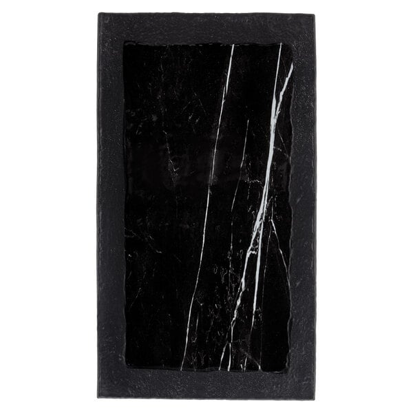 A rectangular black and white marble and slate serving platter.