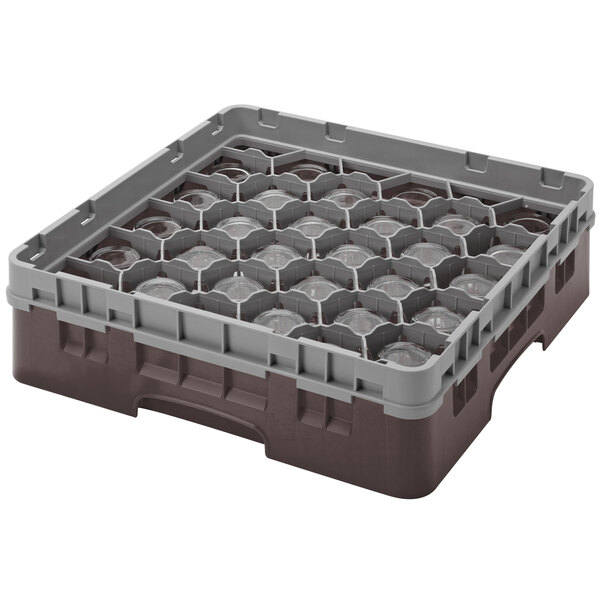 A brown plastic Cambro glass rack with 30 compartments and 4 extenders.