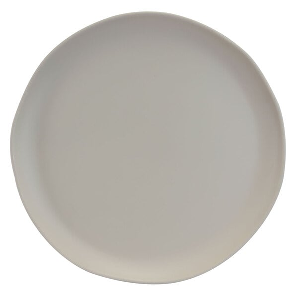 An Elite Global Solutions matte vanilla melamine plate with a small rim.