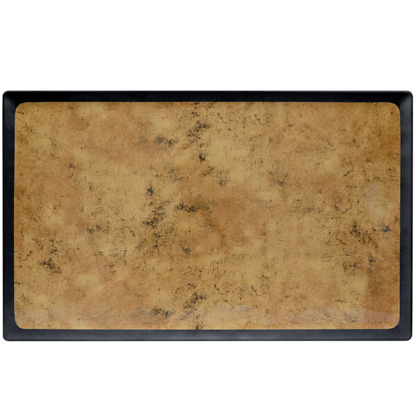 A rectangular black and gold Kobe melamine tray on a counter.