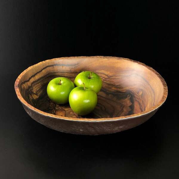 An Elite Global Solutions Sequoia wood grain melamine bowl filled with green apples.