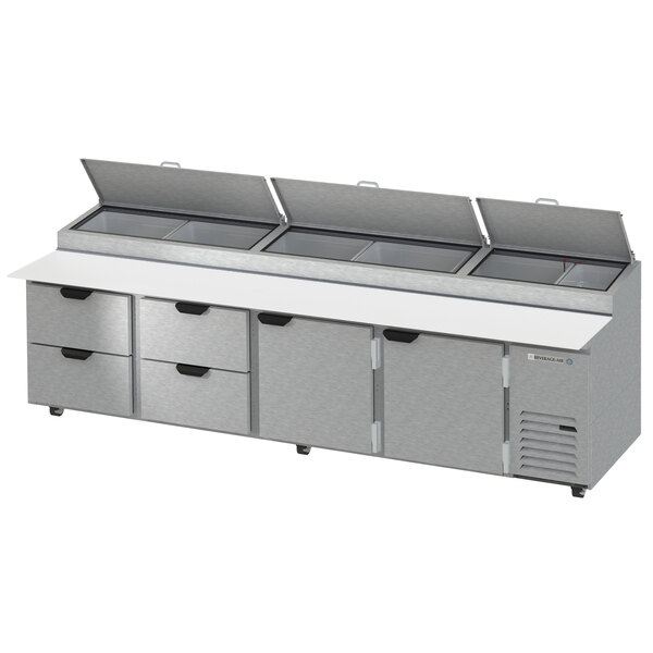 A Beverage-Air refrigerated pizza prep table with two doors and four drawers.